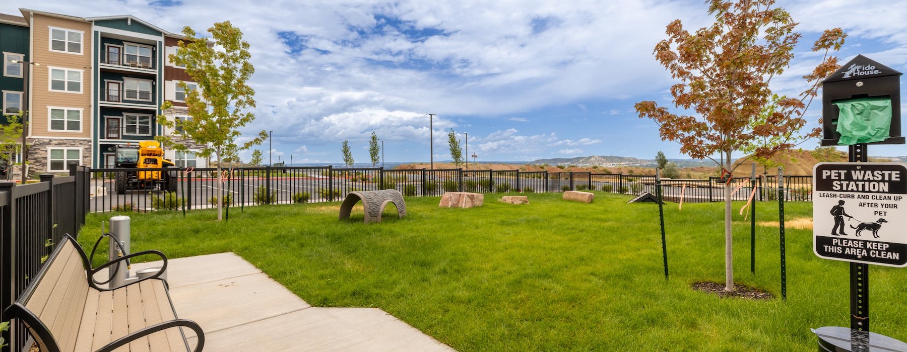 a dog park with a bench