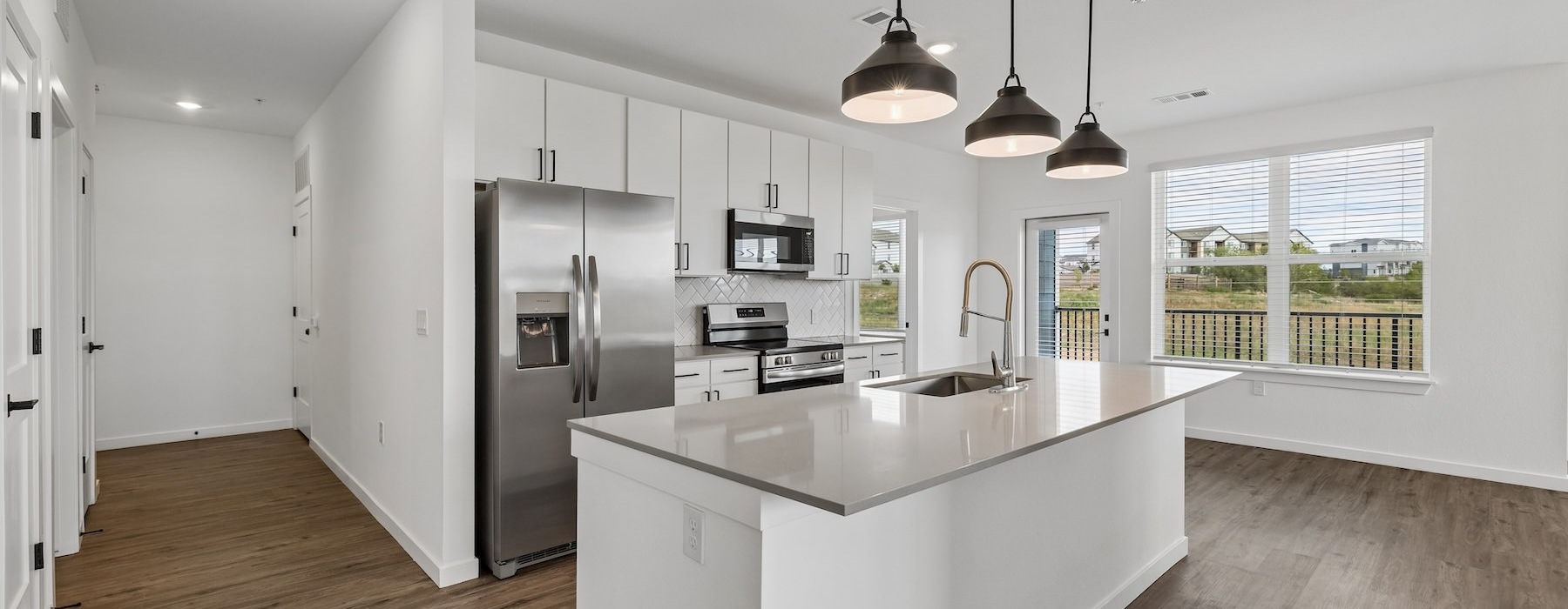 a kitchen with a white island